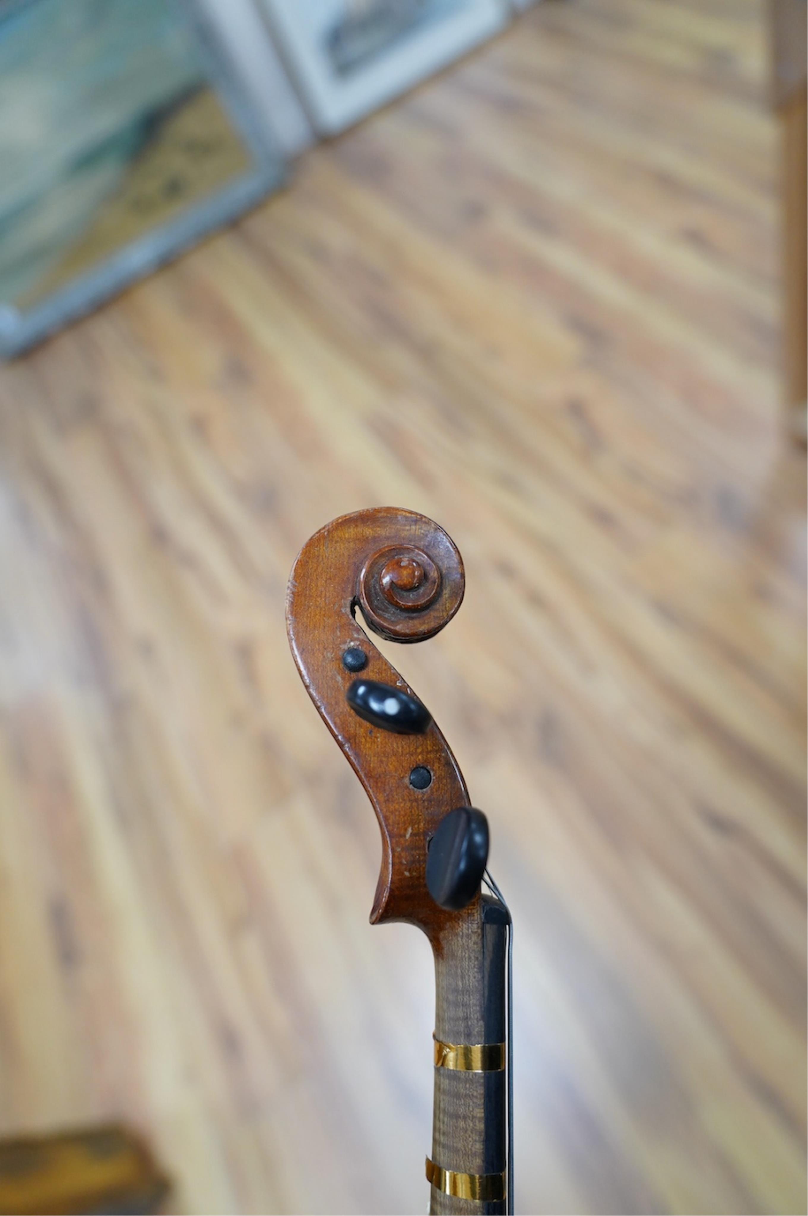 Two late 19th or early 20th century violins, one with case, back of largest measures 36cm. Condition - poor to fair